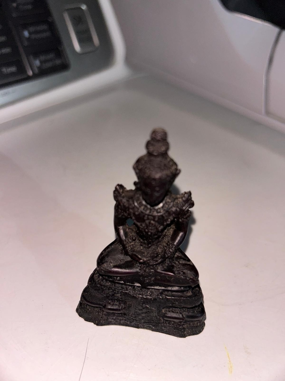 Thai Buddha amulet or small devotional statue depicting the Emerald Buddha (Phra